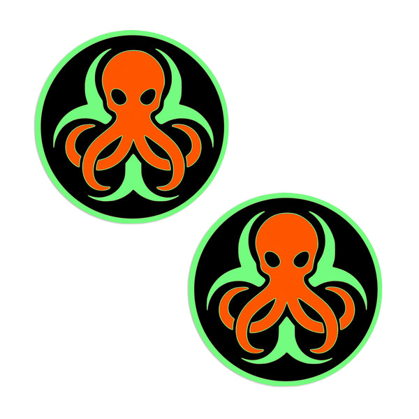 Two circular stickers with orange octopus designs on a black background.