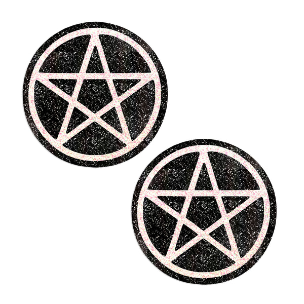 Two black and white pentagram pasties on a white background