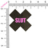 Black 'X' with 'SLUT' in pink on a white background with a ruler for scale.