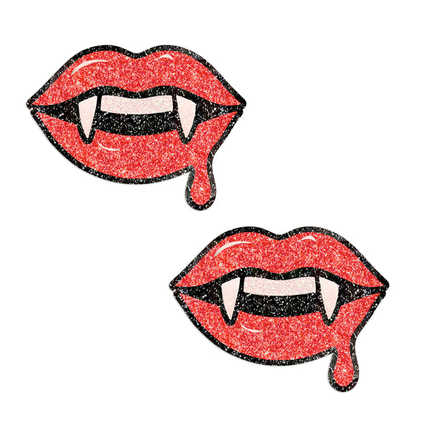 Illustration of glittery lips with fangs on a white background